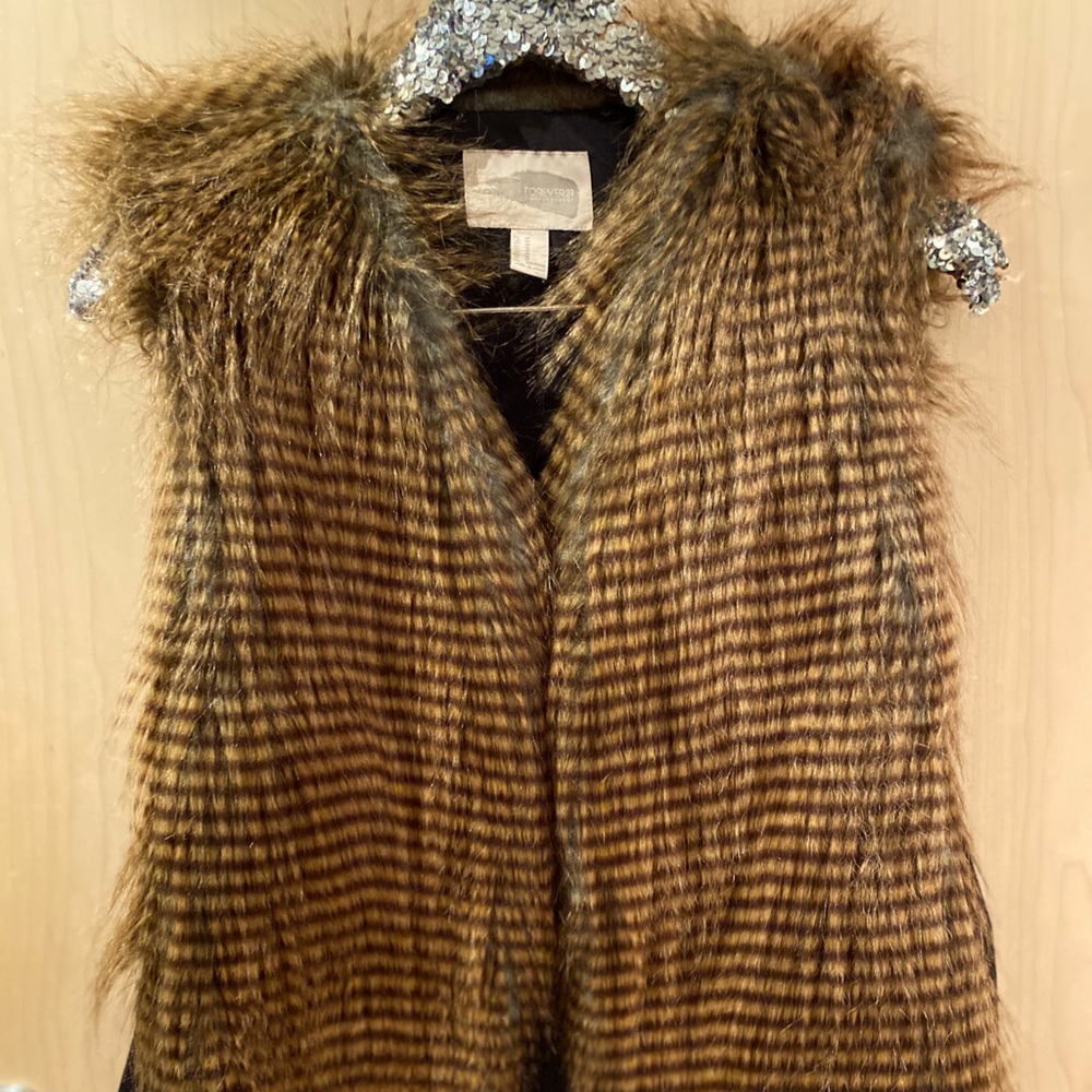 Forever 21 faux fur vest with side panels.